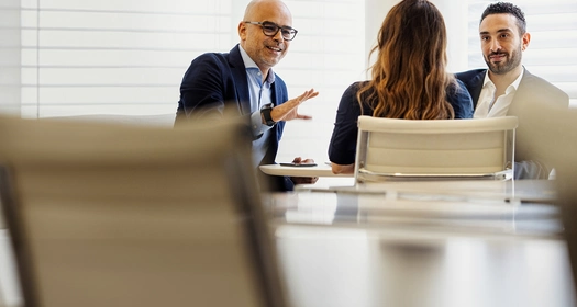Man and woman behind computer
