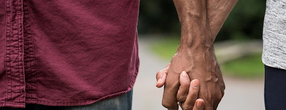 A couple holding hands