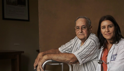 HCP with a patient on a walker