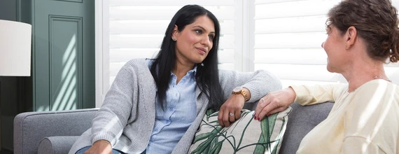 Two women discussing