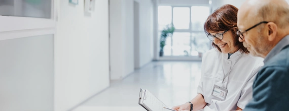Healthcare professional talking with patient.