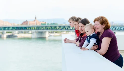 Family smiling at the sea