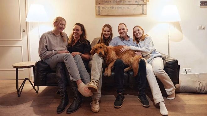Marc Rijken family sitting on a sofa