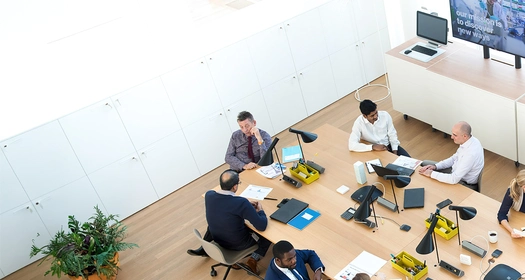 People at the table with screens