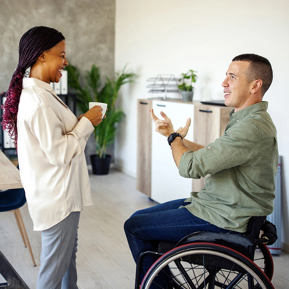 Two business people casually chatting
